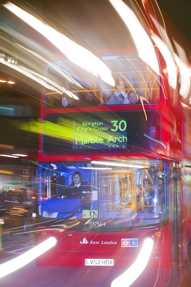 A London bus at night outside Kings Cross, London, England, United Kingdom, Europe