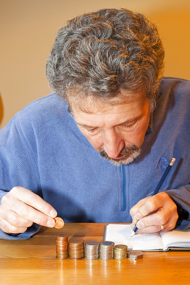 A miserly man counting his money