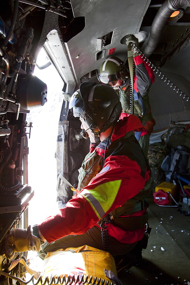 A Navy Sea King helicopter crew help to evacuate an injured walker in the Lake District, Cumbria, England, United Kingdom, Europe