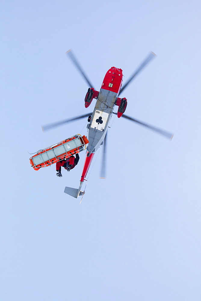 A Navy Sea King evacuates a seriously injured walker who had fallen 250 feet on Bow Fell in the Lake District, Cumbria, England, United Kingdom, Europe