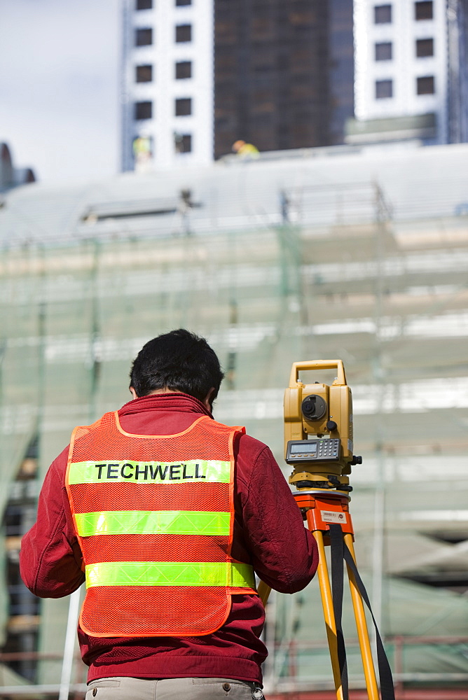 A surveyor working on a construction project in Dubai, United Arab Emirates, Middle East