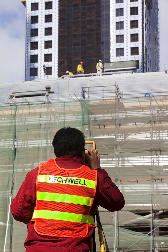 A surveyor working on a construction project in Dubai, United Arab Emirates, Middle East