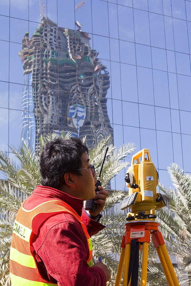 A surveyor working on a construction project in Dubai, United Arab Emirates, Middle East