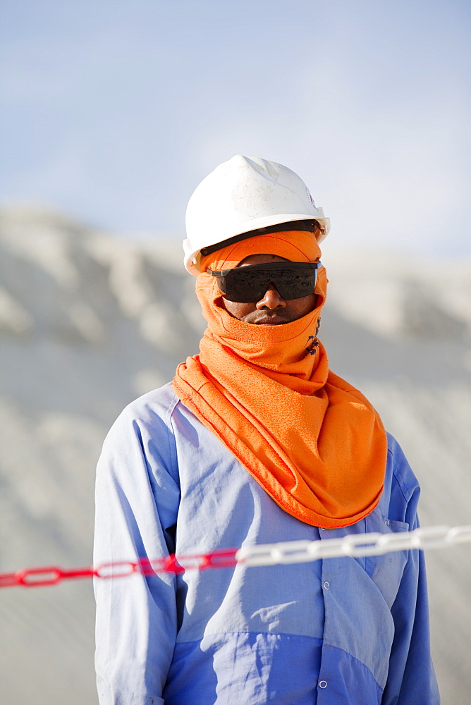 Arab worker on a reclamation scheme to build another exclusive hotel resort on what was formerly sea bed in Dubai, United Arab Emirates, Middle East