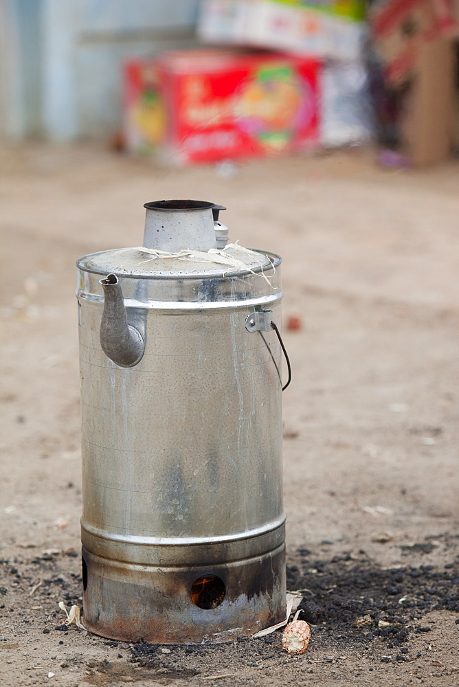 An integral kettle stove used for boiling water by burning old corn husks in northern China, Asia