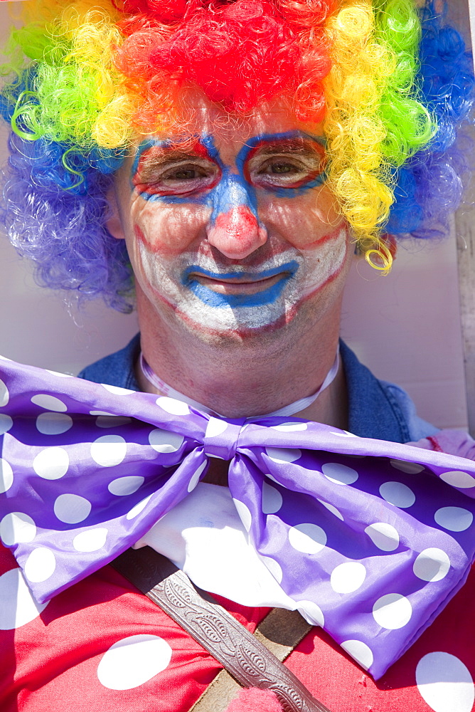 A man dressed up as a clown, Ilfracombe, Devon, England, United Kingdom, Europe