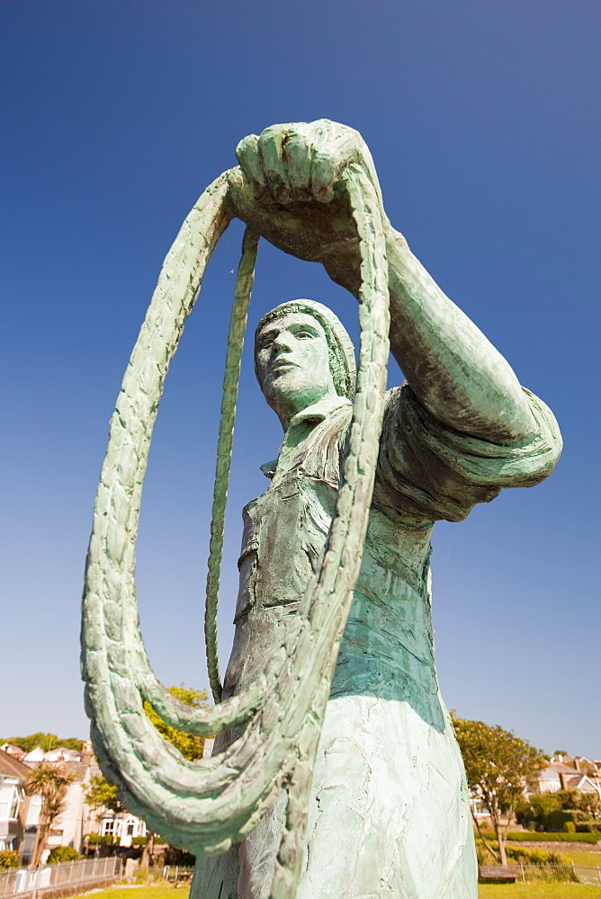 A statue of a young fisherman by local artist Tom Leaper in Newlyn, a memorial to fishermen lost at sea, Cornwall, England, United Kingdom, Europe