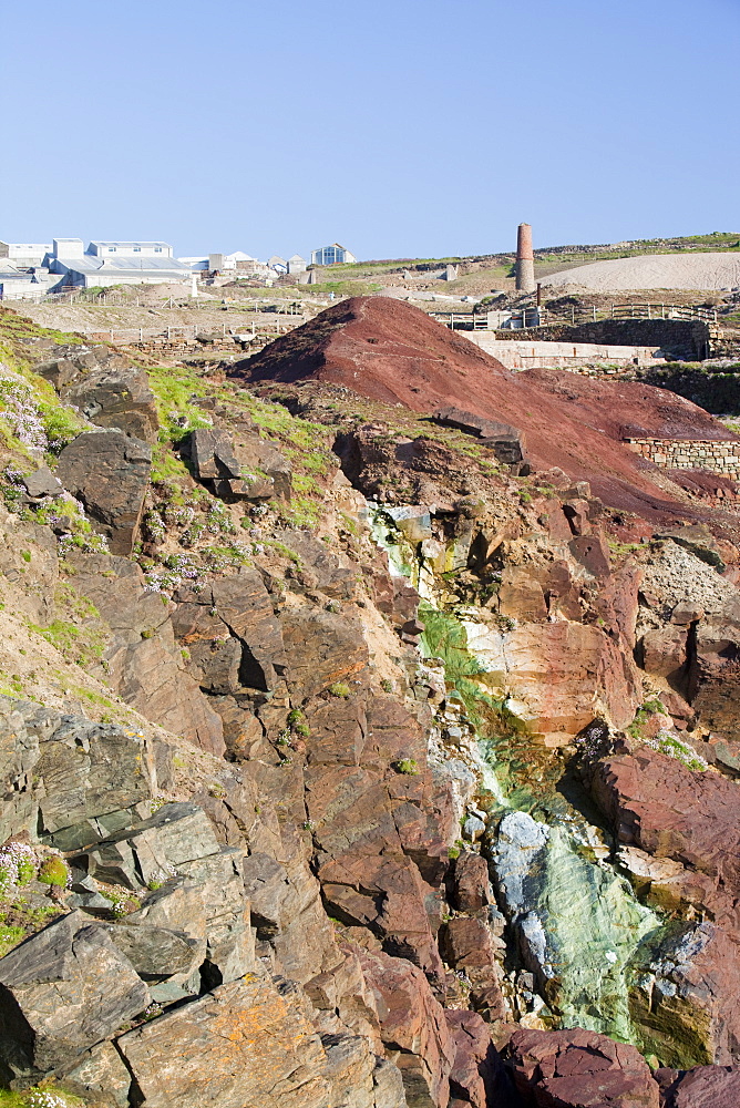 Sea Cliffs stained green from copper deposits leaching from the old Geevor Tin Mine near St Just in Cornwall,, United Kingdom