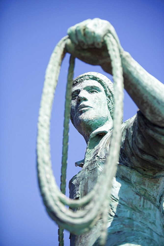 A statue of a young fisherman by local artist Tom Leaper in Newlyn, a memorial to fishermen lost at sea, Cornwall, England, United Kingdom, Europe