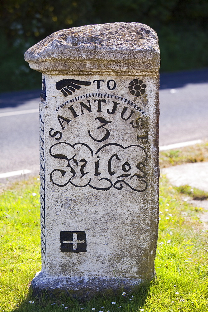 An old stone road sign in Crows an Wra in Cornwall, England, United Kingdom, Europe