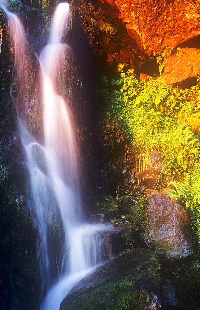 Late evening light on a waterfall above Thirlmere in the Lake District Cumbria, England, United Kingdom, Europe