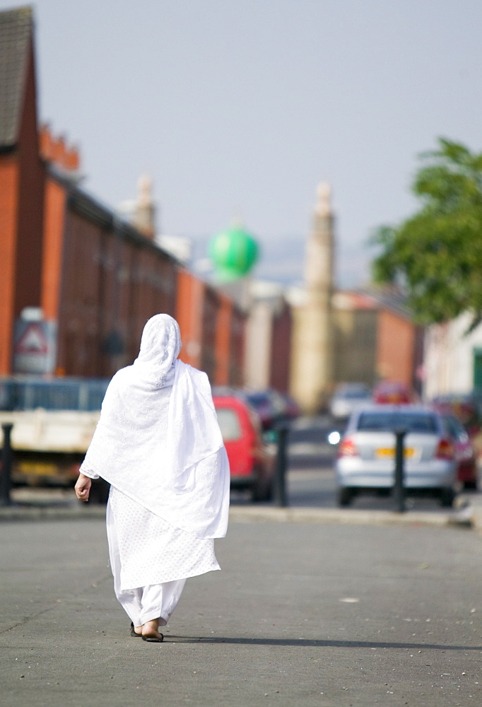 A Muslim woman in a Pakistani area of Blackburn, Lancashire, England, United Kingdom, Europe