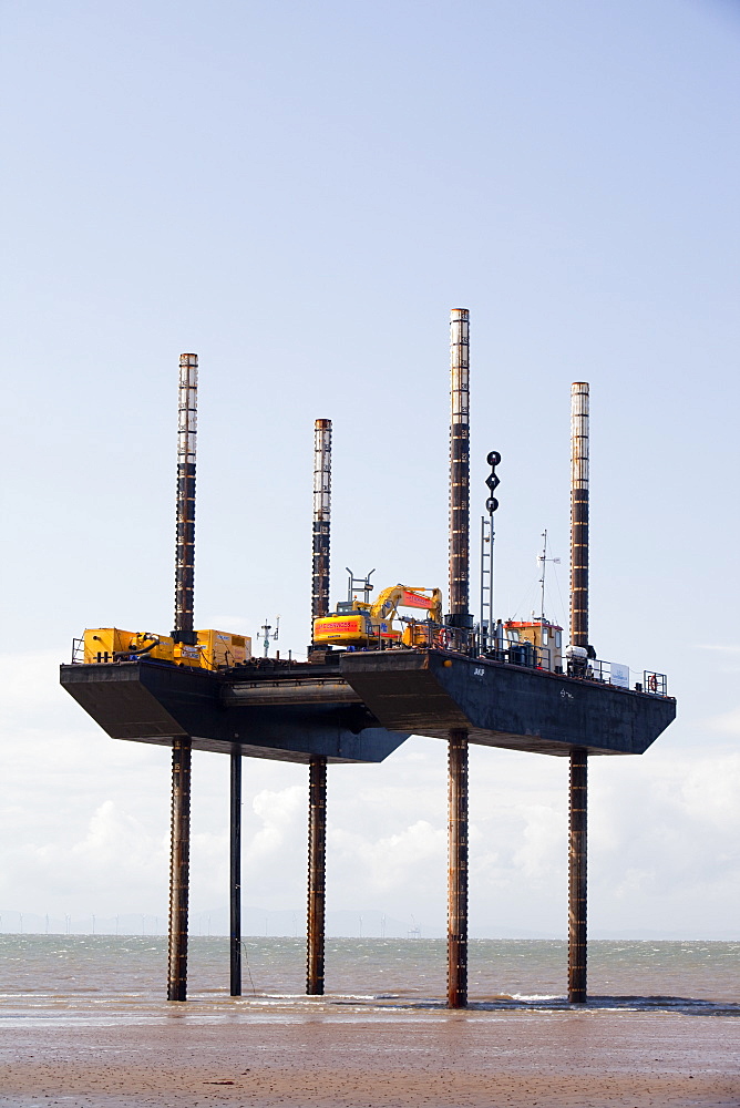 A jack up barge laying the onshore electricity cable from the offshore wind farm, Robin Rigg, in the Solway Firth, north of Workington, Cumbria, England, United Kingdom, Europe