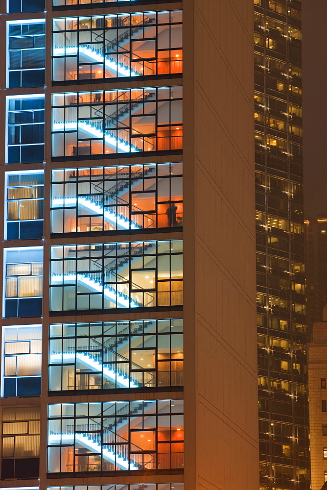 Office blocks lit up at night in Hong Kong, China, Asia