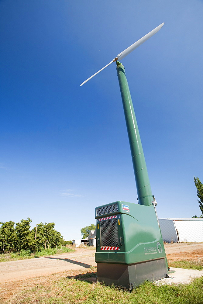 A frost defender to protect the young fruit from late frosts on a fruit farm near Shepperton, Victoria, Australia, Pacific