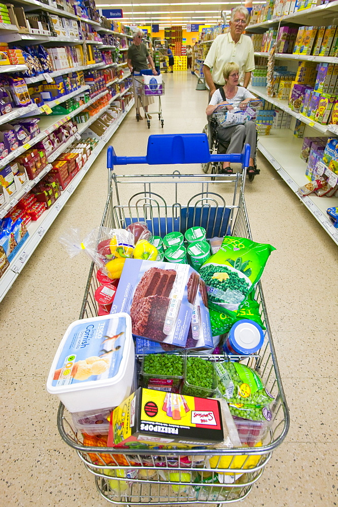 A full trolley of food shopping in a supermarket, Cumbria, England, United Kingdom, Europe