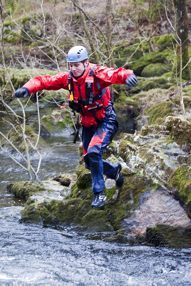 Members of the Langdale Ambleside Mountain Rescue Team train in Swift water rescue techniques on the River Brathay at Skelwyth, Lake District, Cumbria, England, United Kingdom, Europe