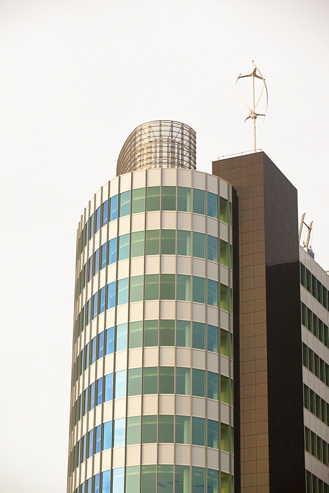 An urban wind turbine on the roof of The Peninsula, a new office development in Manchester, England, United Kingdom, Europe