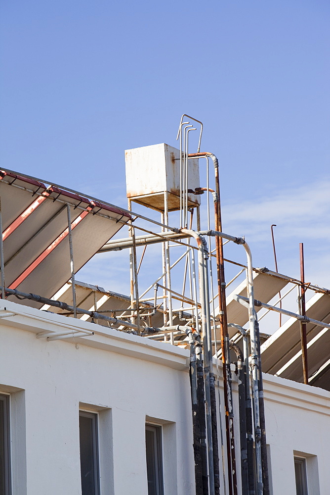 Solar water heating panels on the roof of a launderette in Teos, Turkey, Eurasia