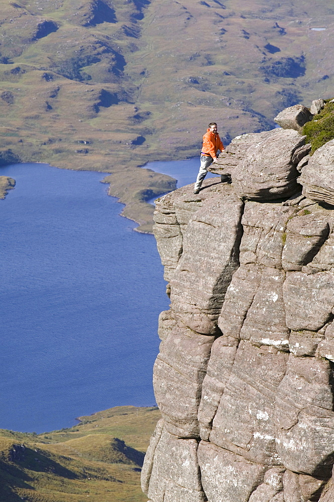 A climber on Stac Pollaidh in Assynt, Sutherland, Scotland, United Kingdom, Europe