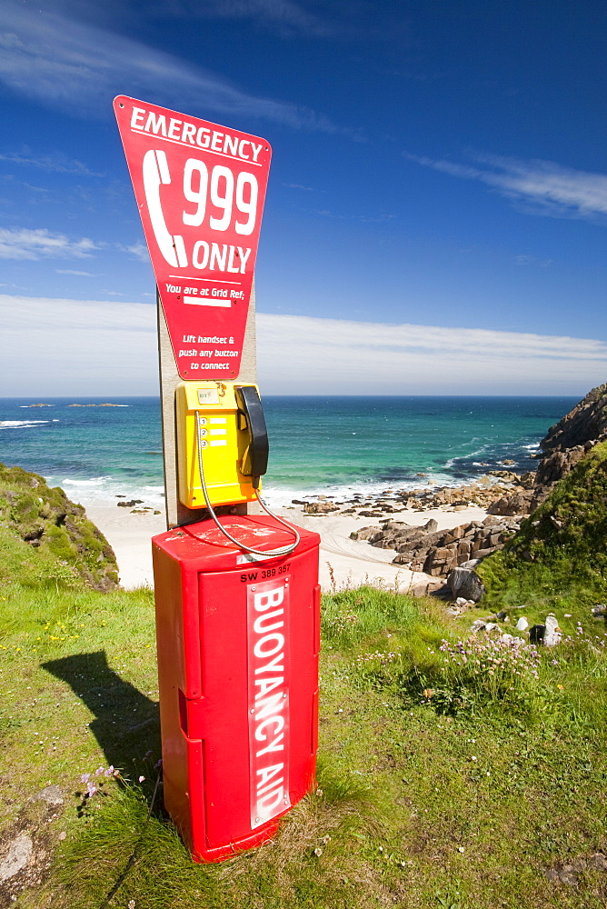 An emergency phone above the beach at Portheras Cove in Cornwall, England, United Kingdom, Europe