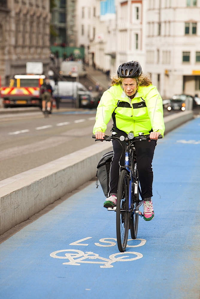 A cyclist on one of the new Cycle Superhighways, in this case the CS7 that goes from Southwark bridge to Tooting, London, England, United Kingdom, Europe