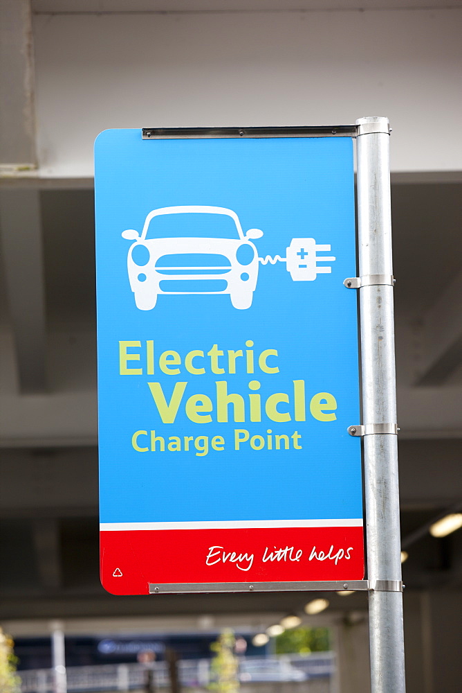 An electric car charging point provided free of charge in a Tesco Supermarket car park for their customers, near Earls Court, London, England, United Kingdom, Europe