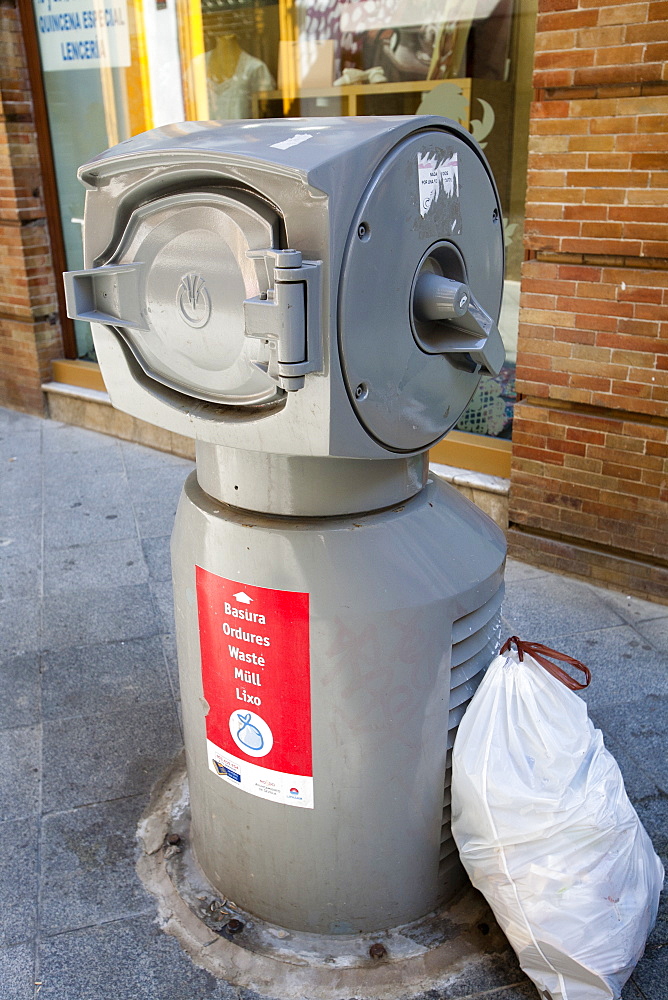 A rubbish shaft  that allows householders to put their household rubbish down a slot to an underground sorting depot, Seville, Andalucia, Spain, Europe