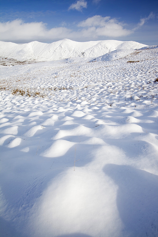 Snowy hummocks on Wansfell above Ambleside, looking towards the Kentmere Fells, Lake District, Cumbria, England, United Kingdom, Europe