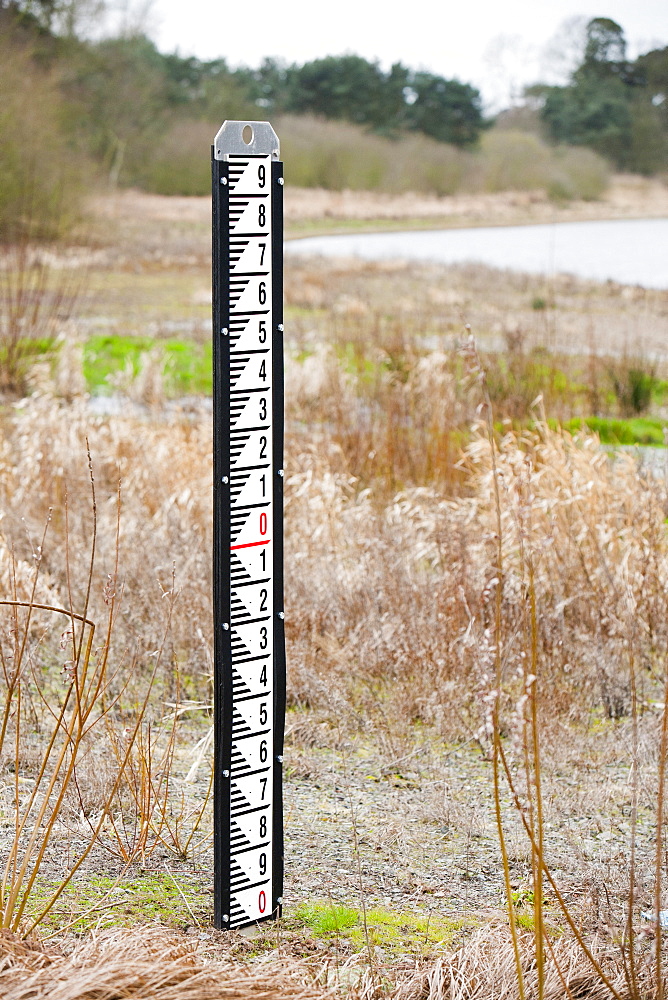 A measuring depth guage left high and dry in early March 2012 at Cropston Reservoir near Loughborough in Leicestershire, England, United Kingdom, Europe