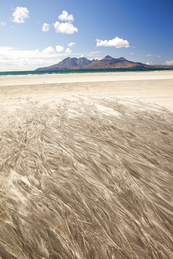 The Bay of Laig at Cleadale on the Isle of Eigg, looking towards the Isle of Rhum, Scotland, United Kingdom, Europe