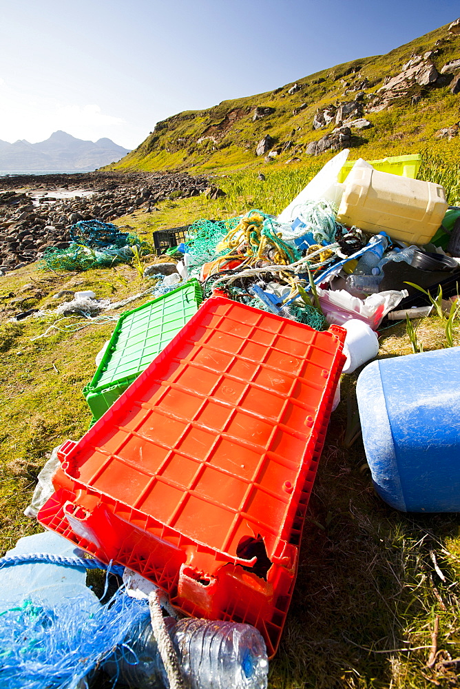 Plastic rubbish washed up at the Singing Sands on the west coast of the Isle of Eigg, Scotland, United Kingdom, Europe