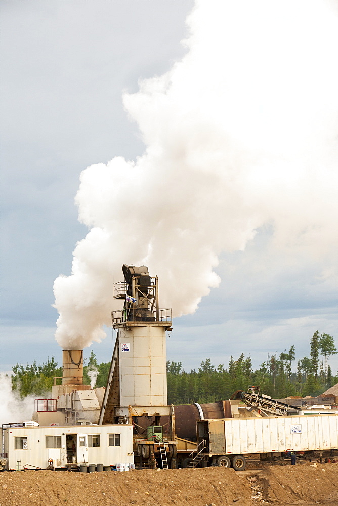 A sand and gravel strip mine producing materials to support the tar sands industry on Highway 63, Alberta, Canada, North America