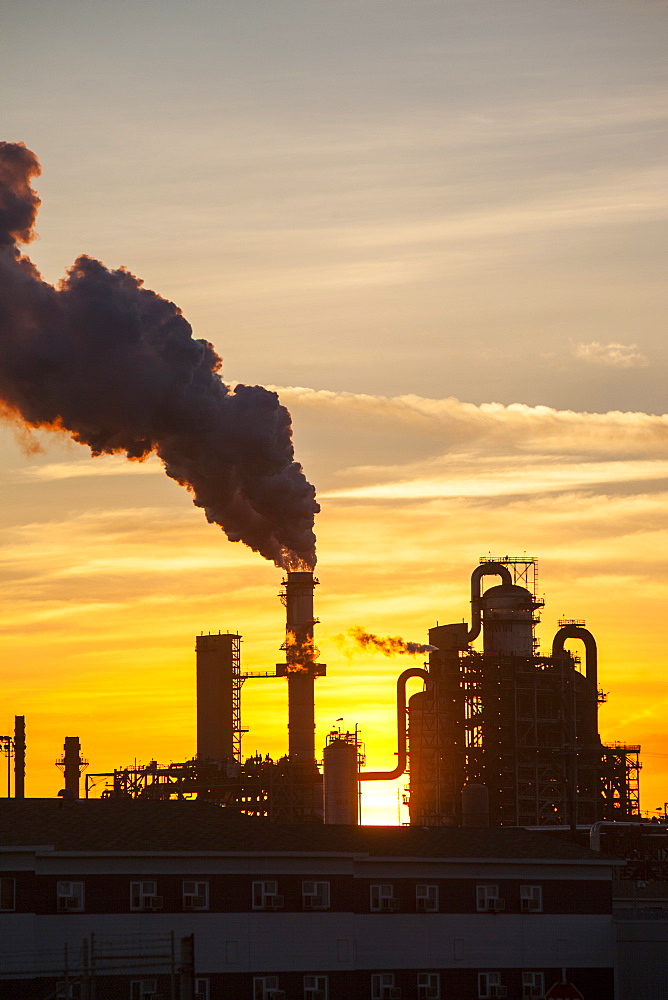 The tar sands upgrader plant at the Syncrude mine north of Fort McMurray at sunset, Alberta, Canada, North America