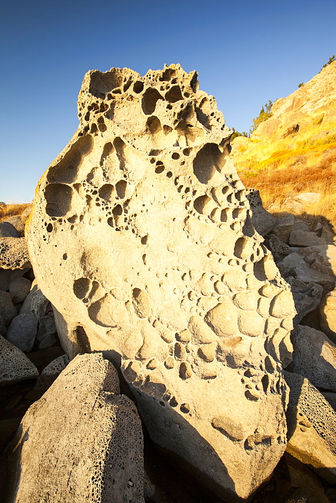 Eroded rocks on the shore at Myrina on Lemnos, Greek Islands, Greece, Europe