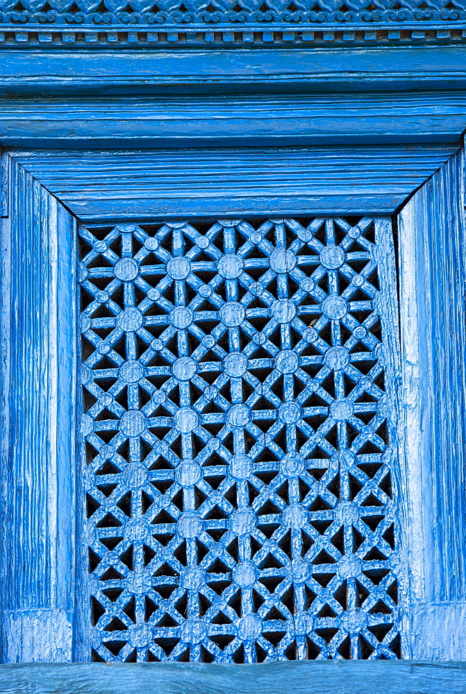 An intricately carved window in the old traditional village of Ghandruk in the Nepalese Himalayas, Nepal, Asia