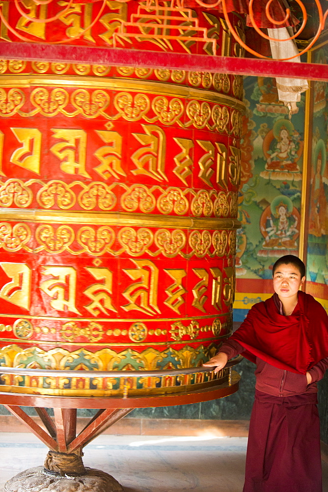 A massive prayer wheel at the Boudhanath Stupa, one of the holiest Buddhist sites in Kathmandu, Nepal, Asia