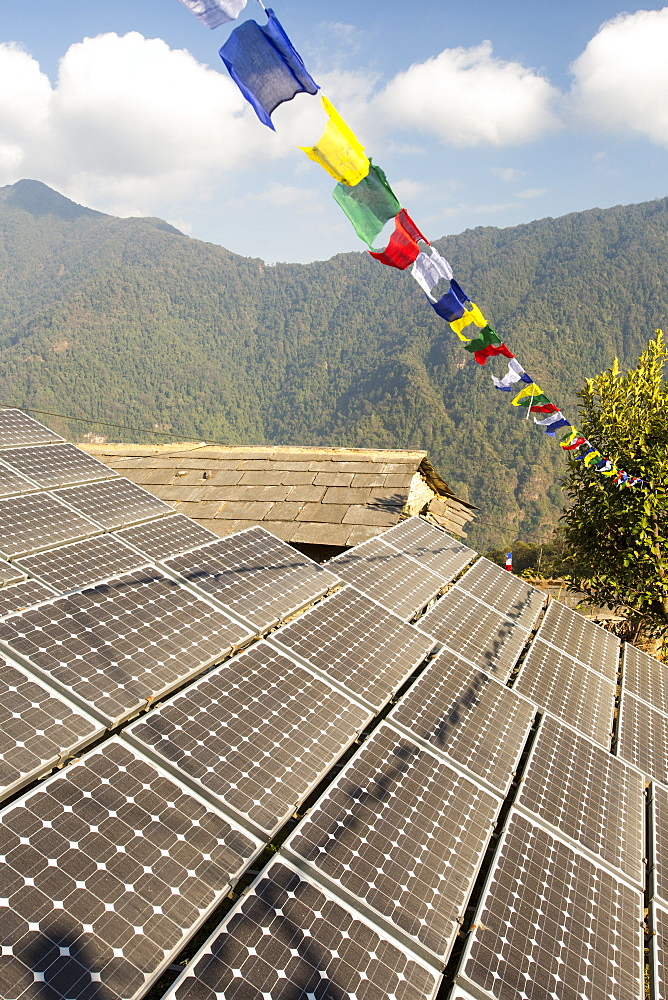 Solar photo voltaic panels being used to power a mobile phone mast at Ghandruk, Himalayas, Nepal, Asia