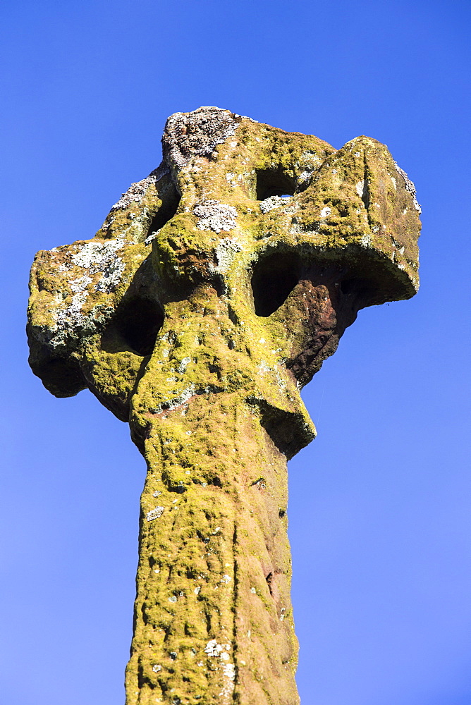 An ancient Anglo Saxon cross depicting Norse mythology in Gosforth church yard, Cumbria, England, United Kingdom, Europe