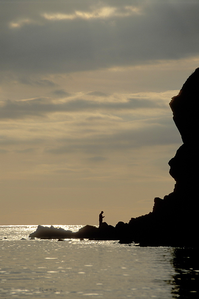 Silhouette of fishermen, Pembrokeshire Coast National Park, West Wales, Uk      (rr)