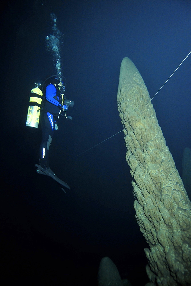 Scuba diver explores underwater cones in cave, Anhumas abyss, Bonito, Mato Grosso do Sul, Brazil, South America