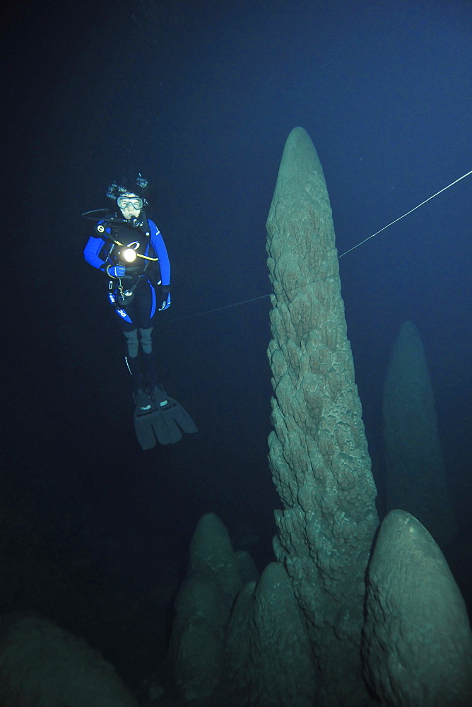 Scuba diver explores underwater cones in cave, Anhumas abyss, Bonito, Mato Grosso do Sul, Brazil, South America