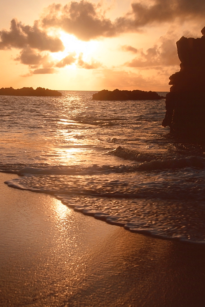 Waves and sunset at Waimea Bay, North Shore, Oahu, Hawaii, United States of America, Pacific