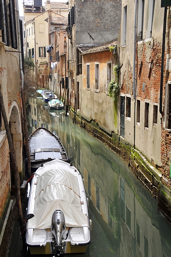 Old buildings built over canals and boats, Venice, UNESCO World Heritage Site, Veneto, Italy, Europe