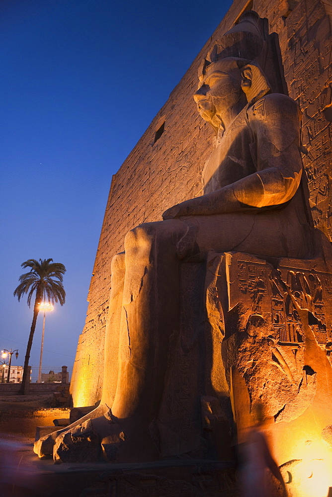 Colossal statues of Rameses II on his thron, Luxor Temple. Luxor, Nile Valley, Egypt, Africa 