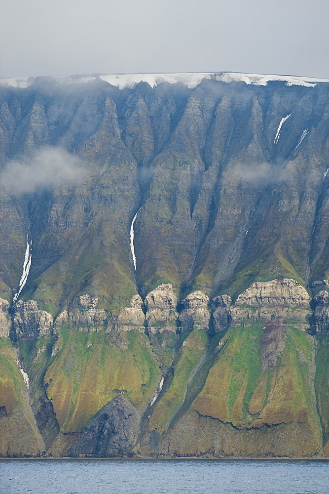 Rock formations on mountain side. Longyearbyen, Svalbard, Norway