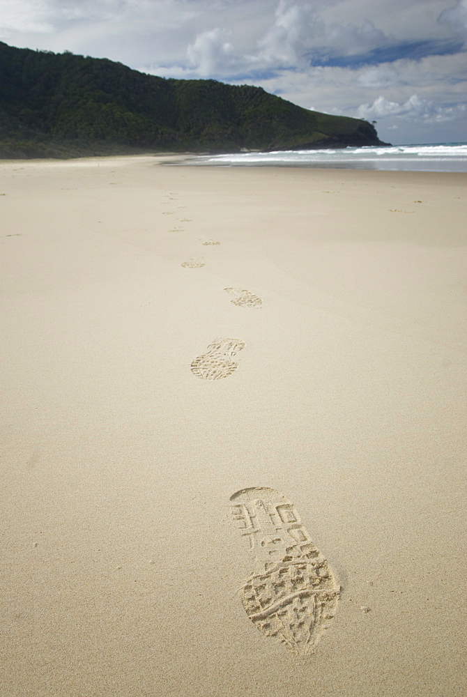 Footsteps in the sand on a beach. South West Rocks, NSW, Australia