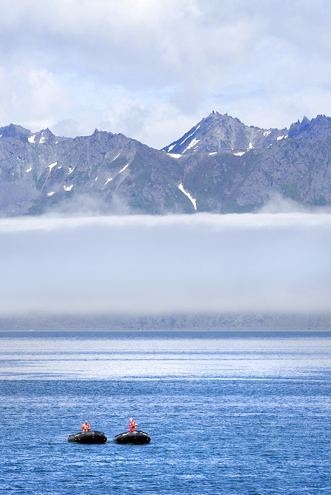 Zodiacs with mountains in the background. Petropavlovsk, Kamchatka, Russia