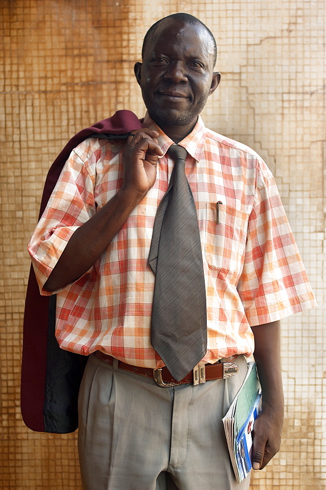 Portrait of an office worker in Downtown Kampala, Uganda. Kampala, Uganda, East Africa