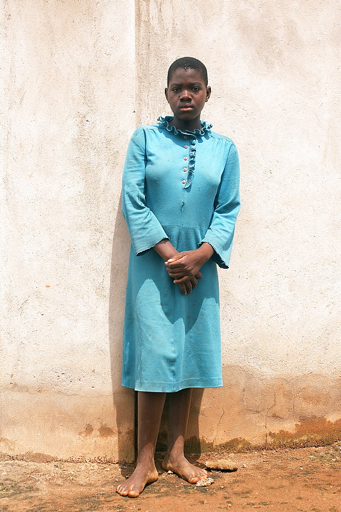 Portrait of a local resident in Gulu Town, Northern Uganda.  She is in her Sunday best. Gulu Town, Uganda, East Africa